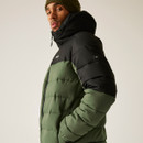 Side profile of male model wearing Regatta Aldthorn men’s padded jacket in olive green with black upper panels and hood, featuring side-entry zip pocket and embossed sleeve badge.