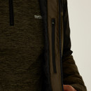 Close-up of a person wearing a two-tone brown jacket with a zip pocket over a dark textured jumper. The logo reads "Regatta Great Outdoors."