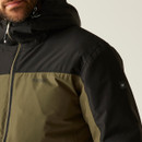 A close-up of a person wearing a two-tone hooded jacket in black and olive green. The Regatta Great Outdoors logo is visible, conveying a casual, outdoor style.
