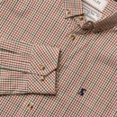 Close-up of a checked shirt in cream with red, green, and navy stripes, showcasing the buttoned cuff, chest pocket with embroidered Joules hare logo, and a visible 'Premium Poplin' interior label near the collar.