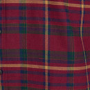 Close-up detail of a red tartan flannel shirt showing a traditional check pattern in green, navy, and mustard yellow with fine weaving and subtle texture.