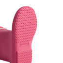 The sole of a bright pink hunter wellington boot. The sole of a bright pink hunter wellington boot.