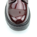 A close up view of a glittery burgundy Heavenly Feet ankle boot on a white background A close up view of a glittery burgundy Heavenly Feet ankle boot on a white background