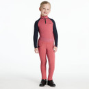 A smiling child wearing a rose pink and navy long-sleeved zip-neck top with “LeMieux” branding on the chest. The outfit is paired with matching rose pink riding leggings featuring tonal full-seat grip with horseshoe and script detail, a wide elastic waistband embossed with “LeMieux”, and black ankle riding boots. Shown against a plain white background.