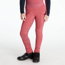 Child wearing rose pink riding leggings with tonal full-seat grip printed with small horseshoes and script branding. The leggings have a wide elastic waistband embossed with “LeMieux” and are paired with a navy long-sleeved top and black ankle riding boots, shown against a plain white background.