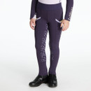 Child wearing deep plum riding leggings with tonal full-seat grip featuring horseshoe and script detail. The leggings have grey angled pocket accents and a wide elastic waistband embossed with “LeMieux”. Paired with a matching long-sleeved top with “LeMieux” branding on the sleeve and black ankle riding boots, shown against a plain white background.