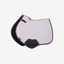 Close-up of a light purple and black LeMieux GP/Jumping cut quilted saddle pad with dark purple binding and black underside, displayed against a plain white background.
