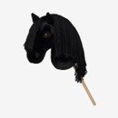 Black plush hobby horse head with long braided yarn mane, mounted on a wooden stick, set against a plain white background.