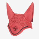 A red LeMieux fly hood featuring a crocheted design with solid fabric ears, black embroidered LeMieux logo on the front, and a black braided trim, displayed against a white background.