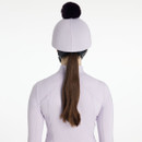 Lilac riding helmet silk with dark faux fur pom-pom, shown from the rear with matching base layer.
