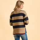 A person in a cosy, striped, tan and navy turtleneck sweater and blue jeans is seen from behind against a soft beige background, conveying a casual, relaxed tone.