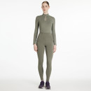 Full-length view of model wearing LeMieux Naomi pull-on breeches in sage green, paired with matching performance top and trainers.