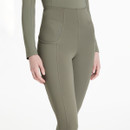 Close-up of sage green LeMieux Naomi breeches waistband and pocket detail with subtle logo branding.