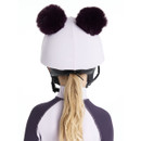 Back view of LeMieux lilac double pom pom riding hat silk cover with fluffy poms, worn over a safety helmet.