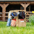 Wooden stable playset by LeMieux featuring a plush pony, toy tack, grooming kit, and hay net for imaginative horse play.