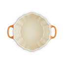 Interior view of the Le Creuset Stoneware Mini Pumpkin Casserole Dish with lid removed, showing the cream-coloured stoneware glaze and two handles.