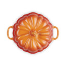 Top-down view of the Le Creuset Stoneware Mini Pumpkin Casserole Dish in Volcanic orange, showing the pumpkin design on the lid with two handles visible.