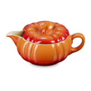 Angled view of the Le Creuset Stoneware Pumpkin Gravy Jug in Volcanic with lid on, highlighting the detailed pumpkin-stem handle and vibrant glaze.