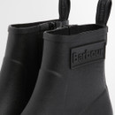 Barbour Layla ankle welly boots in black – close-up of pull tabs and embossed Barbour logo detail.