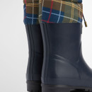 Close-up of rear section of Barbour Mowbray Mid Wellington boots highlighting tartan trim.