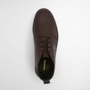 Top-down view of a dark brown leather chukka boot showing laces, rounded toe shape and cushioned opening.