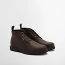 Pair of dark brown leather chukka boots displayed at a three-quarter angle, highlighting the rounded toe and lace closure.