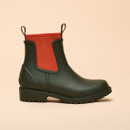 Side view of Joules Oakfield green waterproof ankle welly boots with bright orange elastic gusset.