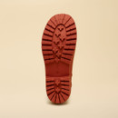 Sole view of Joules Oakfield orange Chelsea wellington boot with deep tread for grip.