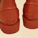 Back heel detail of Joules Oakfield orange Chelsea wellington boots with Joules branding.