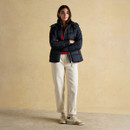 Full outfit with Hadlow navy quilted jacket, red knit jumper and cream trousers