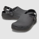 A pair of black clogs with textured soles and adjustable heel straps. The shoes have a rounded, closed toe design, conveying a casual, comfortable style.