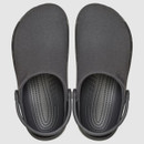 Top view of a pair of black slip-on clogs with closed toes and textured outsoles. They have a smooth finish and adjustable heel straps.