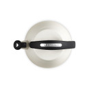 A view of the top of the meringue coloured kettle with a black handle.