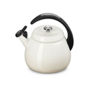 A side view of a meringue coloured kettle with a black handle.