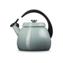 A side view of a light blue kettle with a black handle.