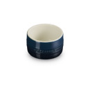 The front of a dark blue stackable ramekin.