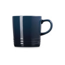 Navy blue stoneware mug with cream interior, straight side view.