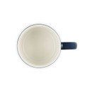 Top-down view of navy blue mug showing cream interior.