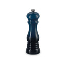 Navy blue Le Creuset salt mill with silver knob, angled side view.