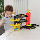 Child enjoying Teamsterz Park and Drive Garage toy set with spiral ramps, working lift and colourful cars.