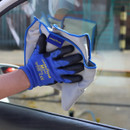 A view of a grey dusting microfibre cloth on a window