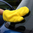 A view of a yellow microfibre dusting glove on a car