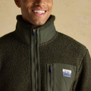 Man smiling in Joules Ashford green fleece with high zip collar.