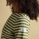 Sleeve detail featuring Joules branded patch on women’s green stripe Harbour top.