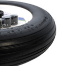 A close-up view of a puncture-proof wheelbarrow wheel on a white background