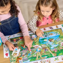 Two young children are engaged in a colourful puzzle. They are pointing and appear focused and curious, conveying a sense of learning and fun. Two young children are engaged in a colourful puzzle. They are pointing and appear focused and curious, conveying a sense of learning and fun.