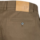 Close-up of brown trousers showing a buttoned rear welt pocket, belt loops and branded leather waistband patch.