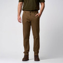 Full-length front view of a man wearing brown slim-fit trousers with side pockets and brown boots.
