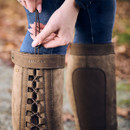 Close-up of top calf adjustment cord on Dublin Pinnacle III boots in brown.