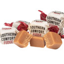 Individually wrapped Southern Comfort Handmade Fudge with golden fudge pieces and red and white wrappers.
